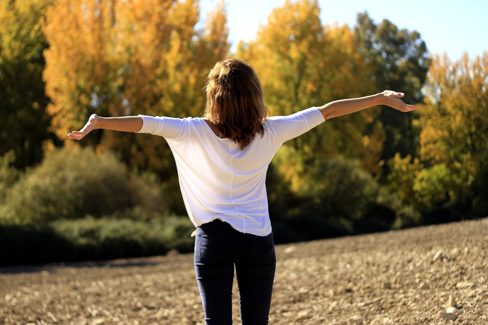 woman walking on a straight clear path