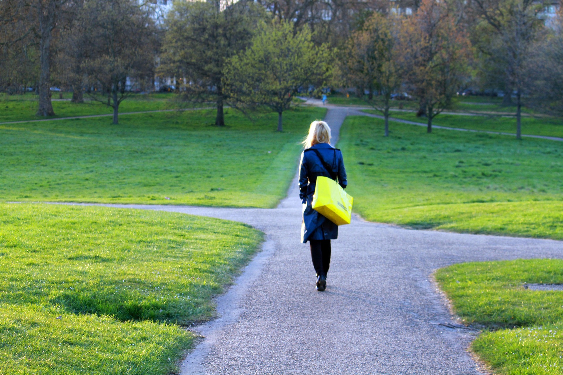 woman walking on a straight clear path